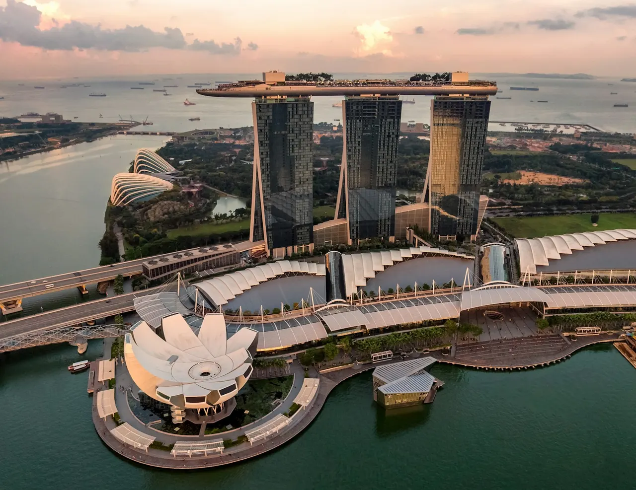 Aerial sunset view of Marina Bay Sands, ArtScience Museum and the Singapore waterfront